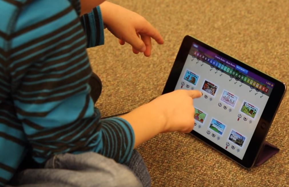 kindergartner using an iPad