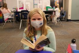 student reading book