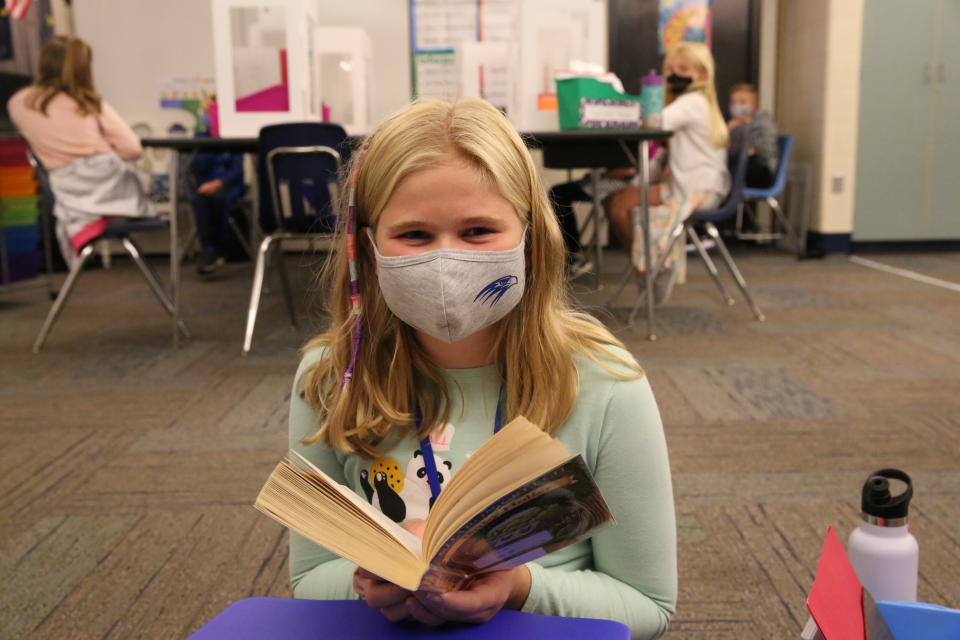 student reading book