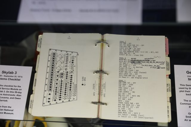 An open book with a diagram of a circuit board, showcasing various electronic components and connections.