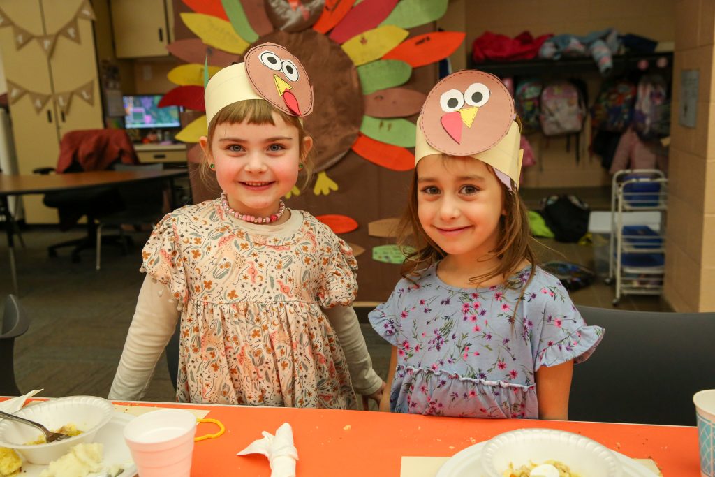 Two students in Thanksgiving outfits