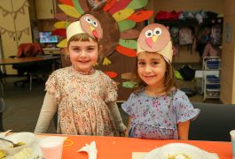 Two students in Thanksgiving outfits