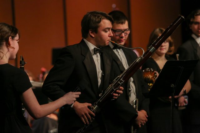 student plays oboe