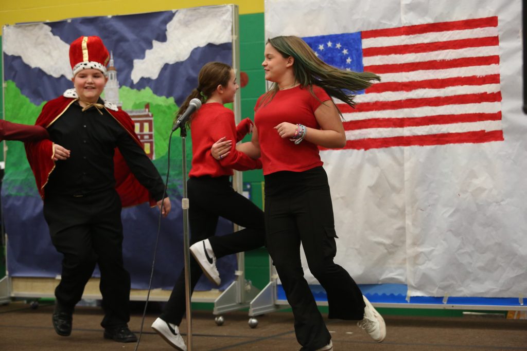 students dancing on stage