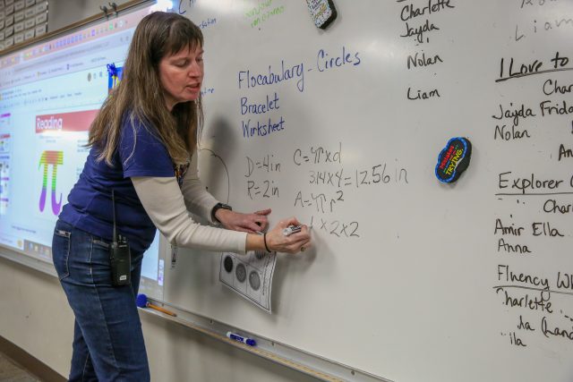 teacher at white board