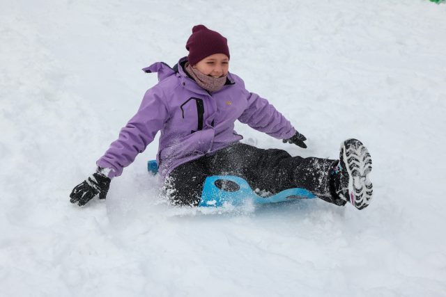girl sled riding