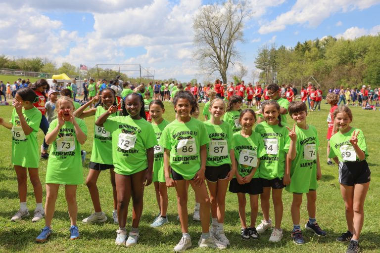 Mary Frank students (wearing lime green shirts) getting ready for Running is Elementary race event and to cheer on their classmates