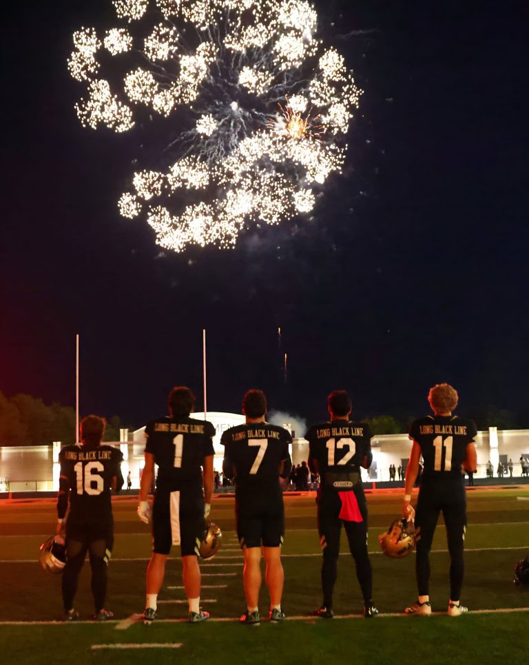 Penn football players watching fireworks